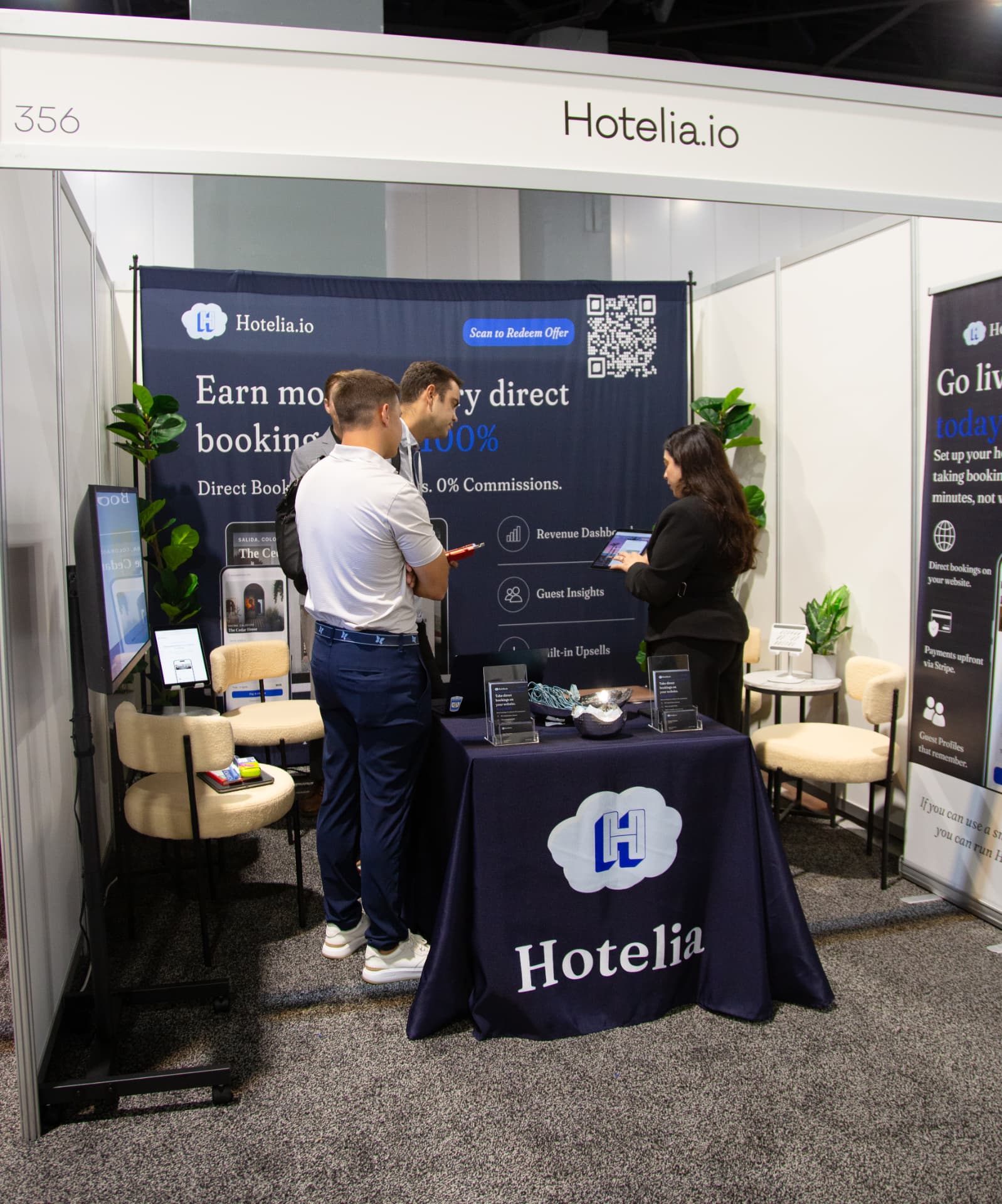 Hotel owners speaking with the Hotelia team at booth 356 during the Independent Hotel Show Miami